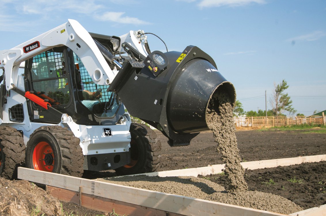 Bobcat S650 Skid Steer Loader dumping cement