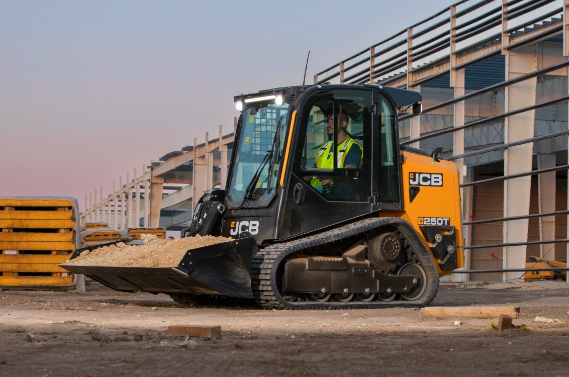 JCB 250T Compact Track Loader hauling dirt on construction site