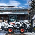 Bobcat L35 Small Articulated Loader clearing snow from a parking lot