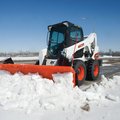 Bobcat S650 Skid Steer Loader plowing snow