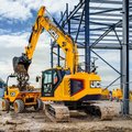 JCB 245XR Crawler Excavator loading a dumpster
