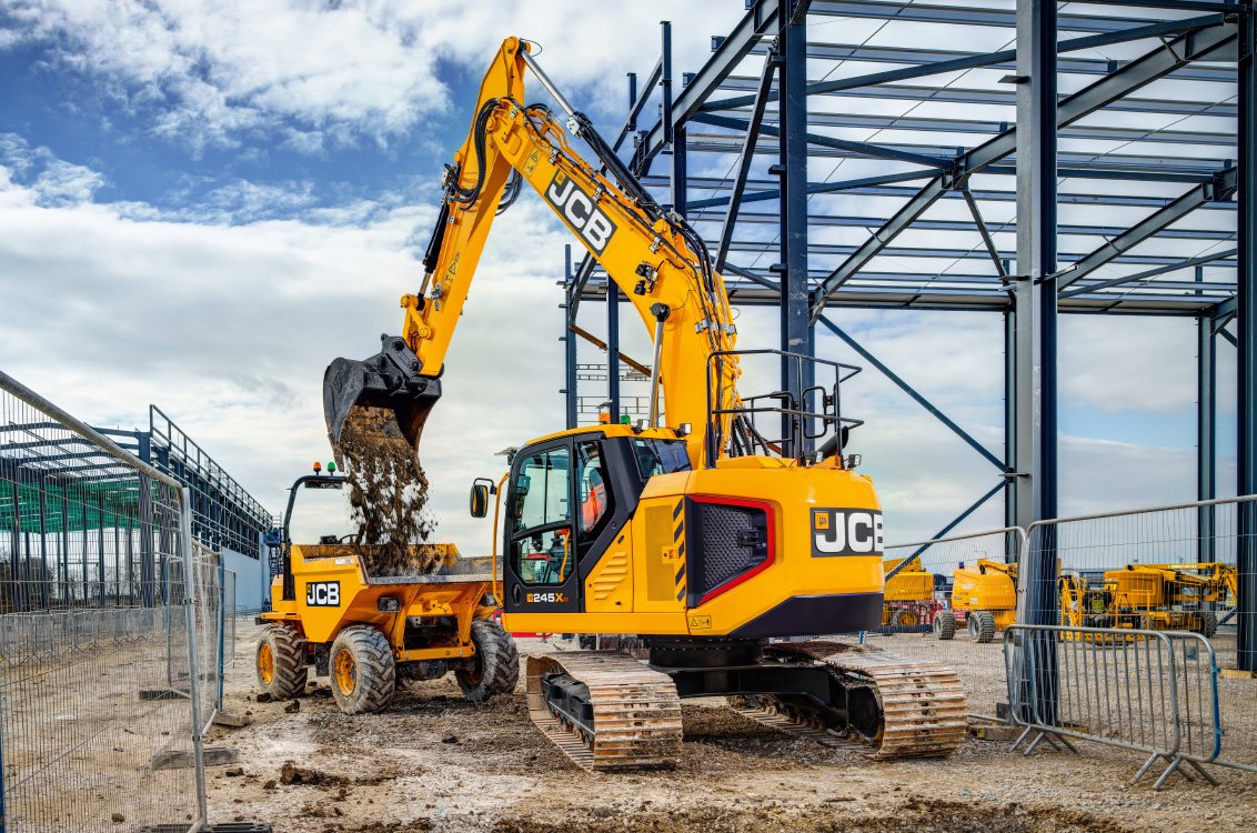 JCB 245XR Crawler Excavator loading a dumpster