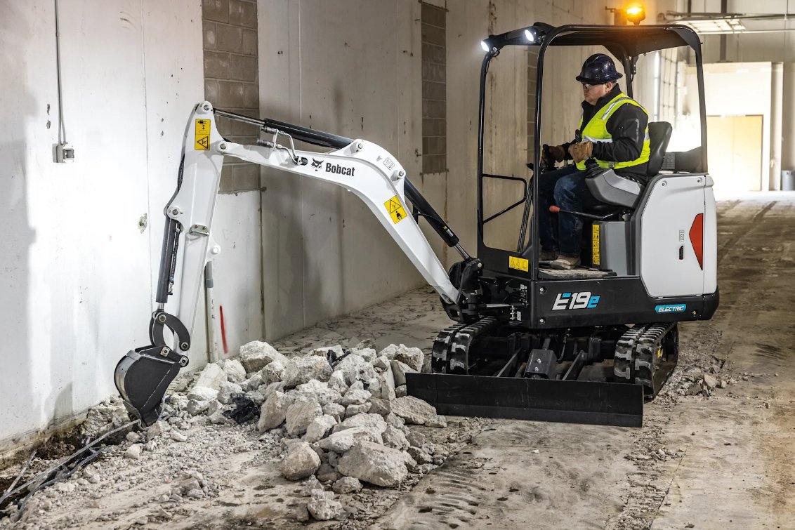 Bobcat E19e Electric Mini Excavator digging cement floor