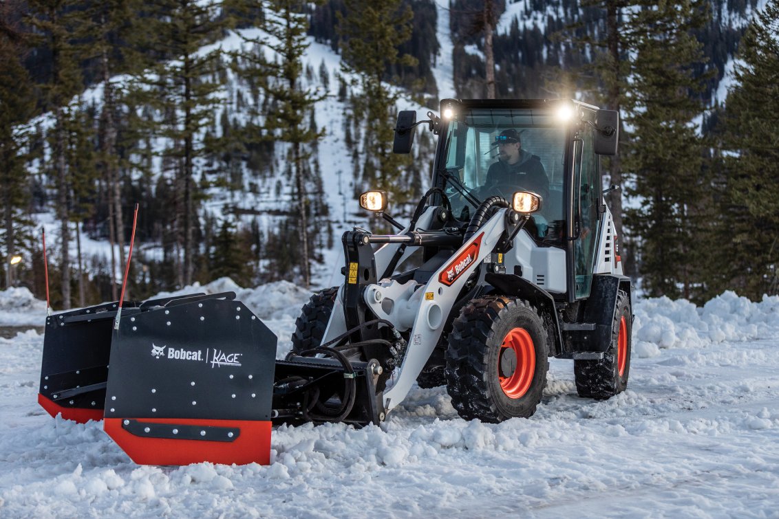 Bobcat L65 Compact Wheel Loader pushing snow