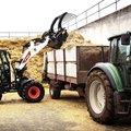 Bobcat L95 Compact Wheel Loader loading hay