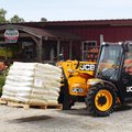 JCB 505-20 Telehandler hauling a pallet of soil