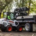 Bobcat L35 Small Articulated Loader dumping dirt into truck