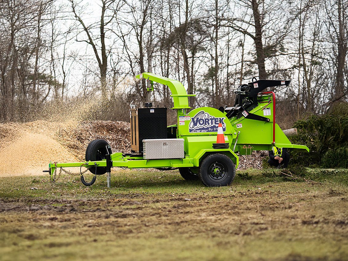VORTEX V12-31 Wood Chipper grinding a small tree and blowing chips into a pile