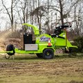 VORTEX V12-31 Wood Chipper grinding a small tree and blowing chips into a pile