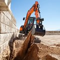 DEVELON DX55R-7 Mini Excavators digging a trench