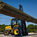 JCB 950 Rough Terrain Forklift moving logs