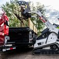 Bobcat MT120 Mini Track Loader dumping debris