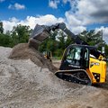 JCB 2TS-7T Teleskid Compact Track Loader dumping gravel