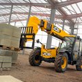 JCB 506-36 Telehandler hauling construction material