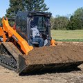 DEVELON DTL35 Compact Track Loader hauling dirt