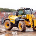 JCB 509-23TC Telehandler hauling construction scrap material