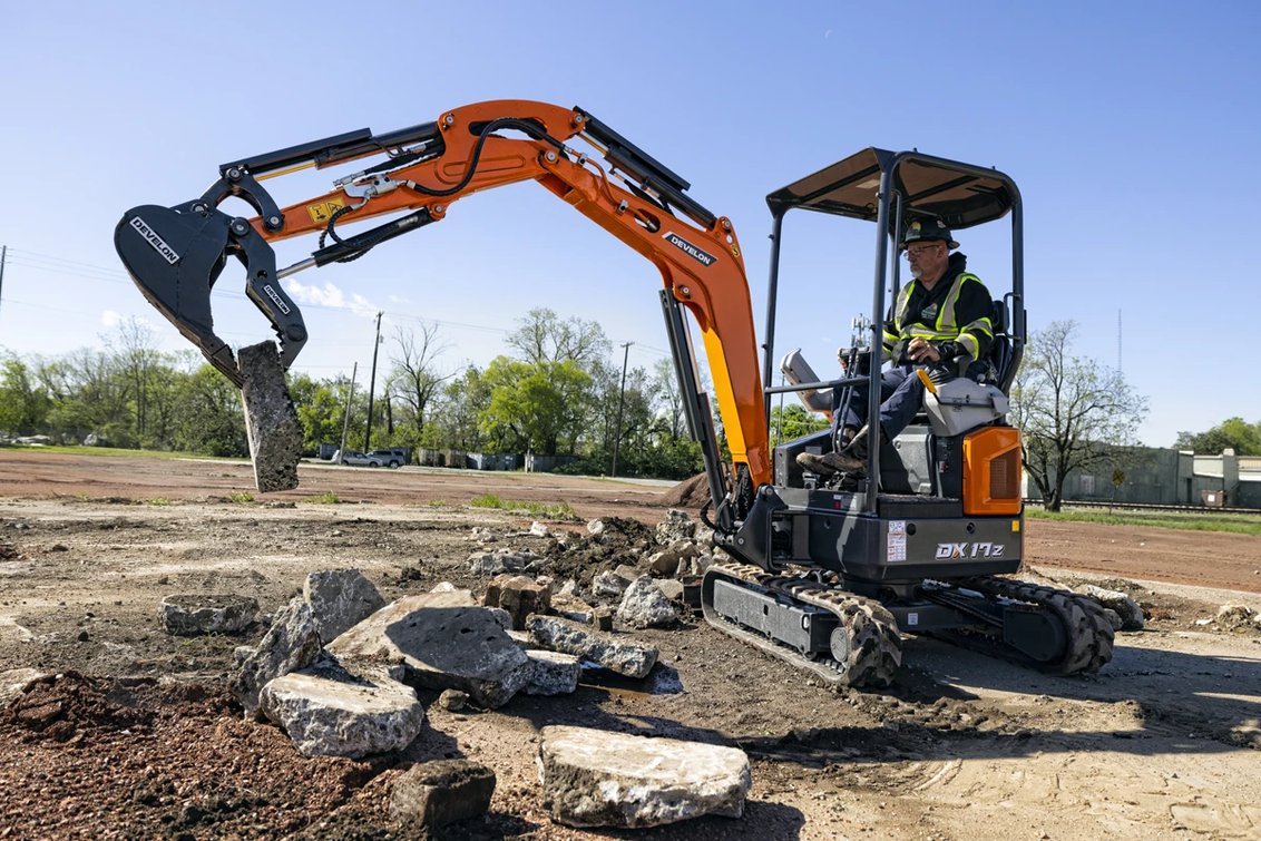 DEVELON DX17Z-7 Mini Excavator moving concrete debris