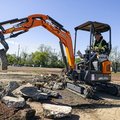 DEVELON DX17Z-7 Mini Excavator moving concrete debris