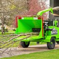 VORTEX V12-31 Wood Chipper grinding a small tree and blowing chips into a truck