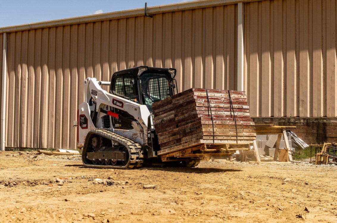 Bobcat T595 Compact Track Loader hauling heavy material