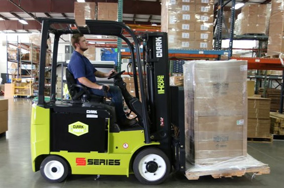 Clark SEC32 Electric Rider Cushion Forklift in a warehouse