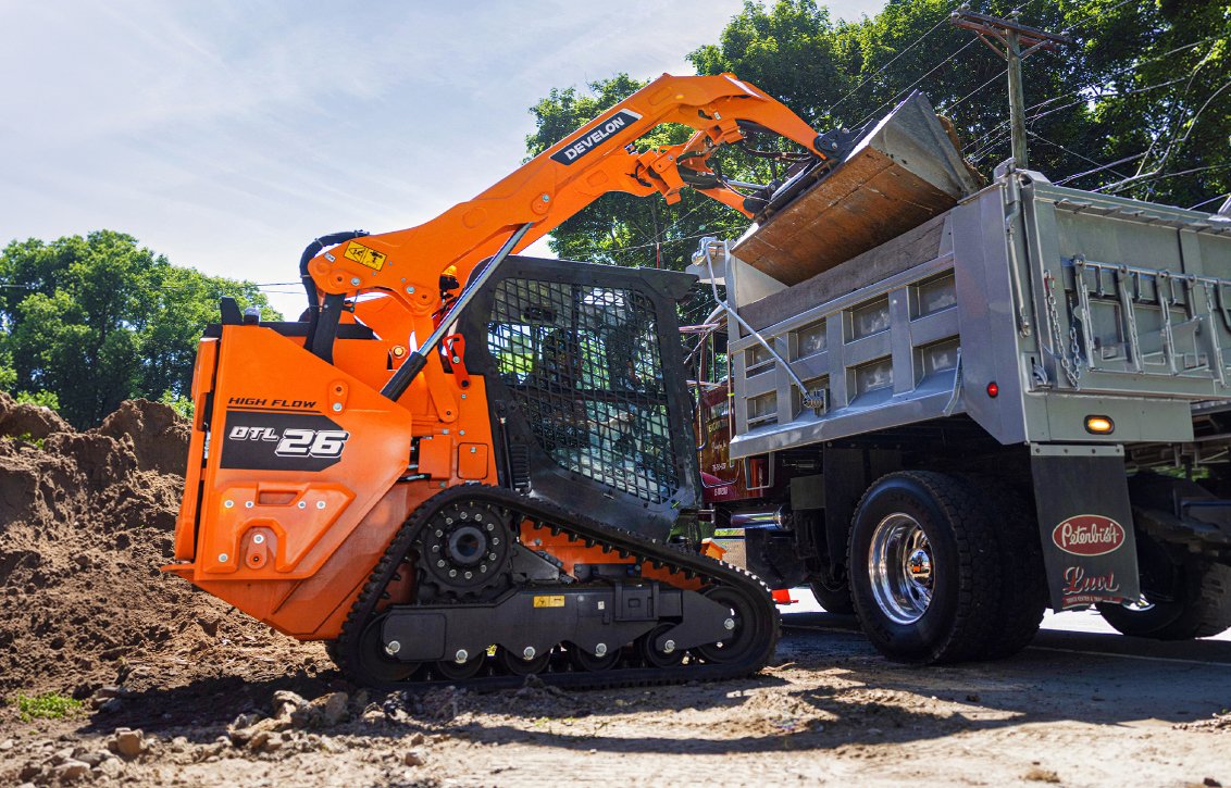 DEVELON DTL26 Compact Track Loader dumping load