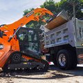 DEVELON DTL26 Compact Track Loader dumping load