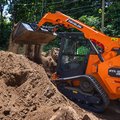DEVELON DTL30 Compact Track Loader dumping dirt