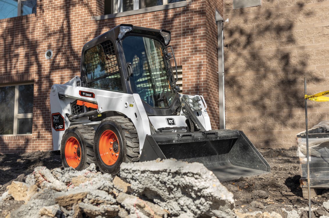 Bobcat S450 Skid Steer Loader removing demolition material