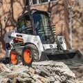 Bobcat S450 Skid Steer Loader removing demolition material