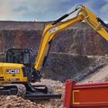 JCB 100C-2 Mini Excavator loading rocks