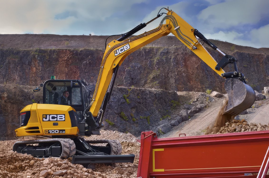 JCB 100C-2 Mini Excavator loading rocks