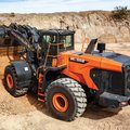 DEVELON DL550-7 Wheel Loader dumping a load of dirt