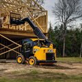 JCB 3TS-8W Teleskid Skid Steer Loader lifting construction material to a higher level