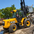 JCB 950 Rough Terrain Forklift moving scrap metal