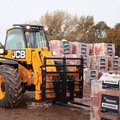 JCB 506-23TC Telehandler hauling construction material