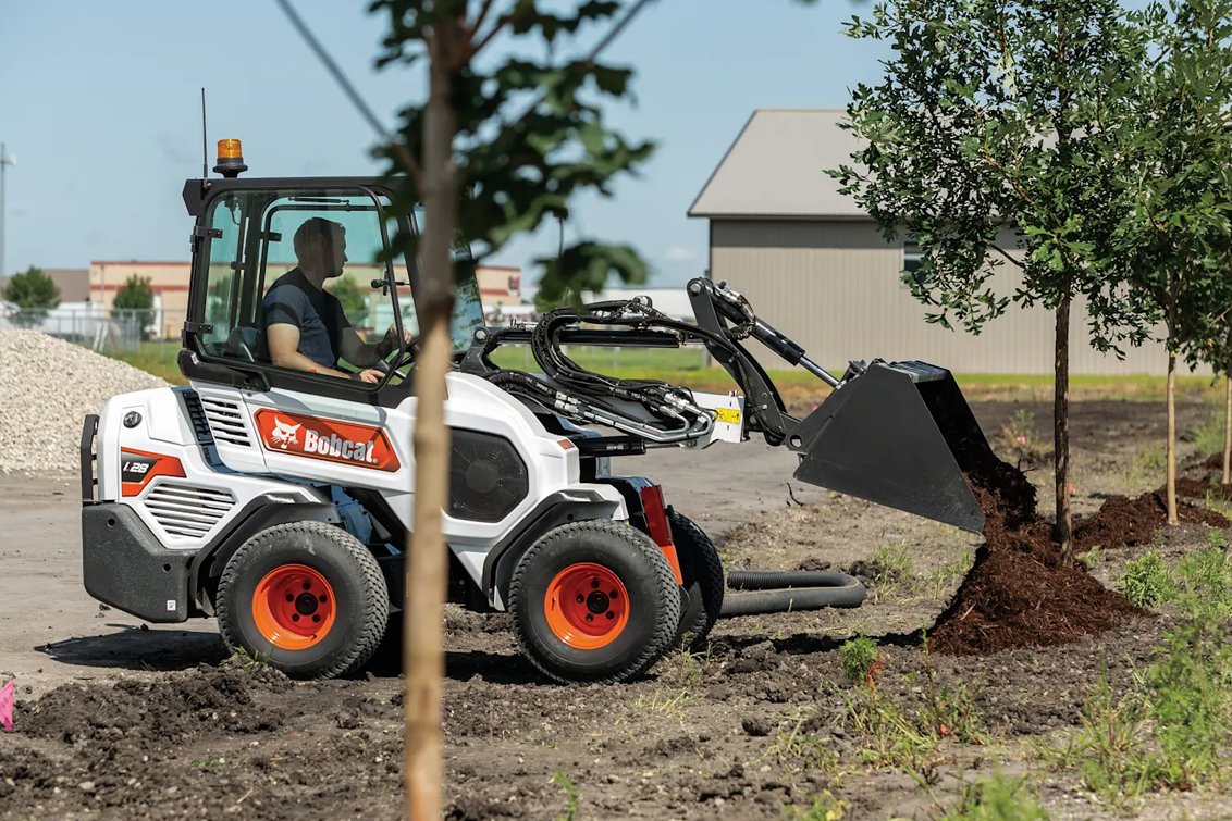 Bobcat L28 Small Articulated Loader dumping mulch