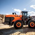 DEVELON DL480-7 Wheel Loader hauling dirt on construction site