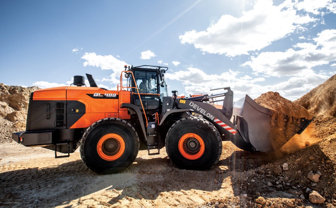 DEVELON DL480-7 Wheel Loader hauling dirt on construction site