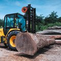 JCB 940 Rough Terrain Forklift moving a large heavy log