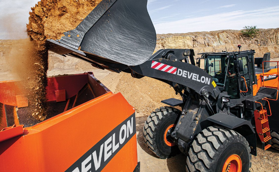 DEVELON DL550-7 Wheel Loader dumping load into DEVELON articulated dump truck