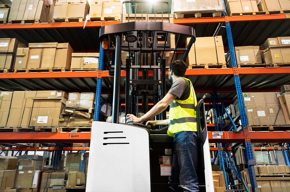 Bobcat B15SU-9 Stand-Up Electric Cushion Forklift in a warehouse