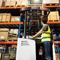 Bobcat B15SU-9 Stand-Up Electric Cushion Forklift in a warehouse
