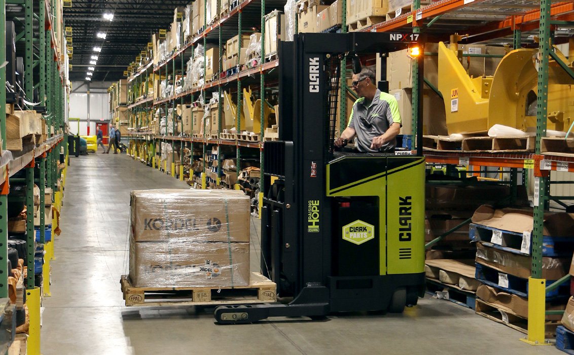 Clark NPX 17 Electric Narrow Aisle Forklifts in a warehouse