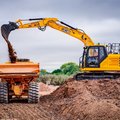 JCB 150X Crawler Excavator loading a dump truck