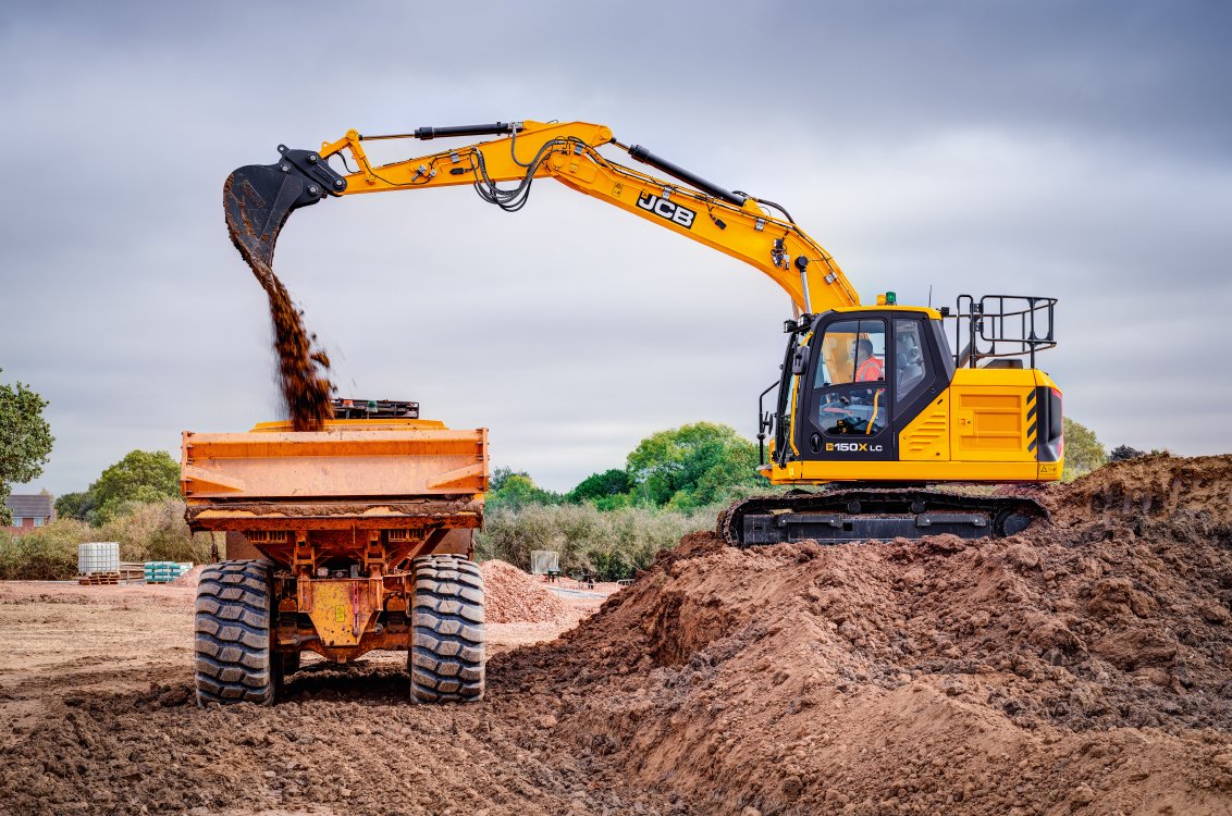 JCB 150X Crawler Excavator loading a dump truck