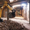JCB 19C-1E Electric Mini Excavator digging inside inside a building
