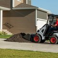 Bobcat L23 - Small Articulated Loader moving soil