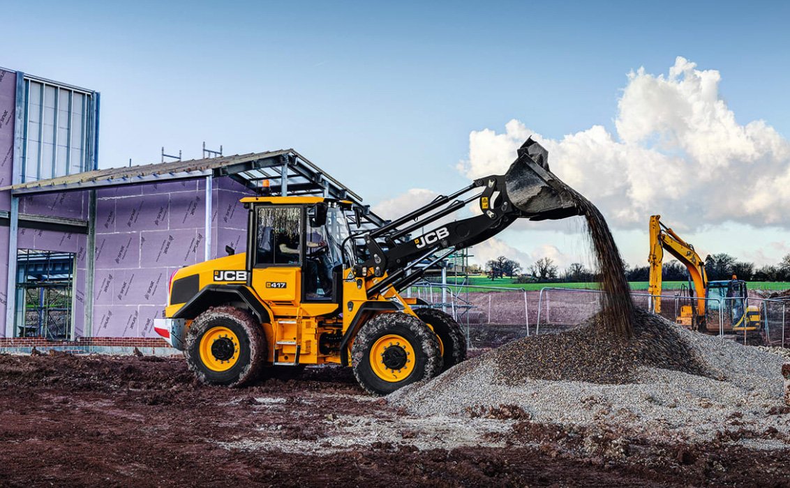 JCB 417 Wheel Loader dumping gravel on a construction site