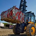 JCB 940 Rough Terrain Forklift hauling a heavy trash bail